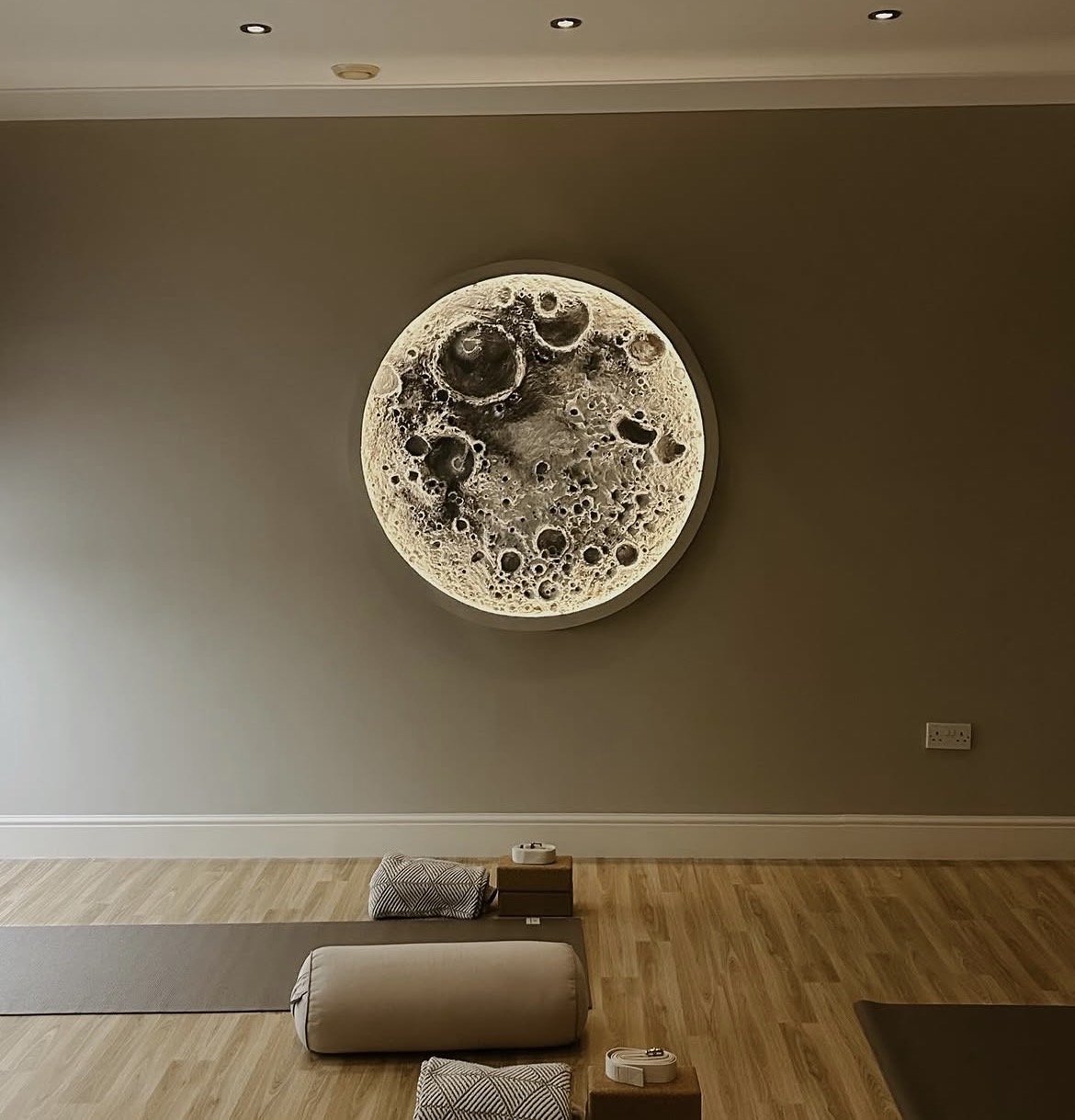 The iconic moon artwork in the View Yoga studio